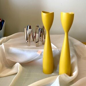Two sets of candle holders